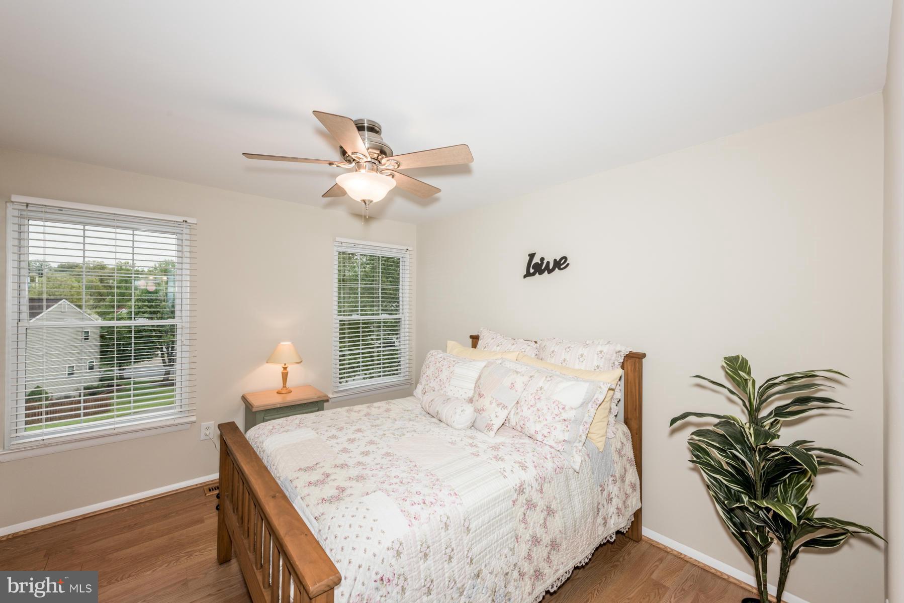 6032 Bakers Place Hanover, MD 21076 - Photo 19 of 30 a bedroom with a large bed and a window