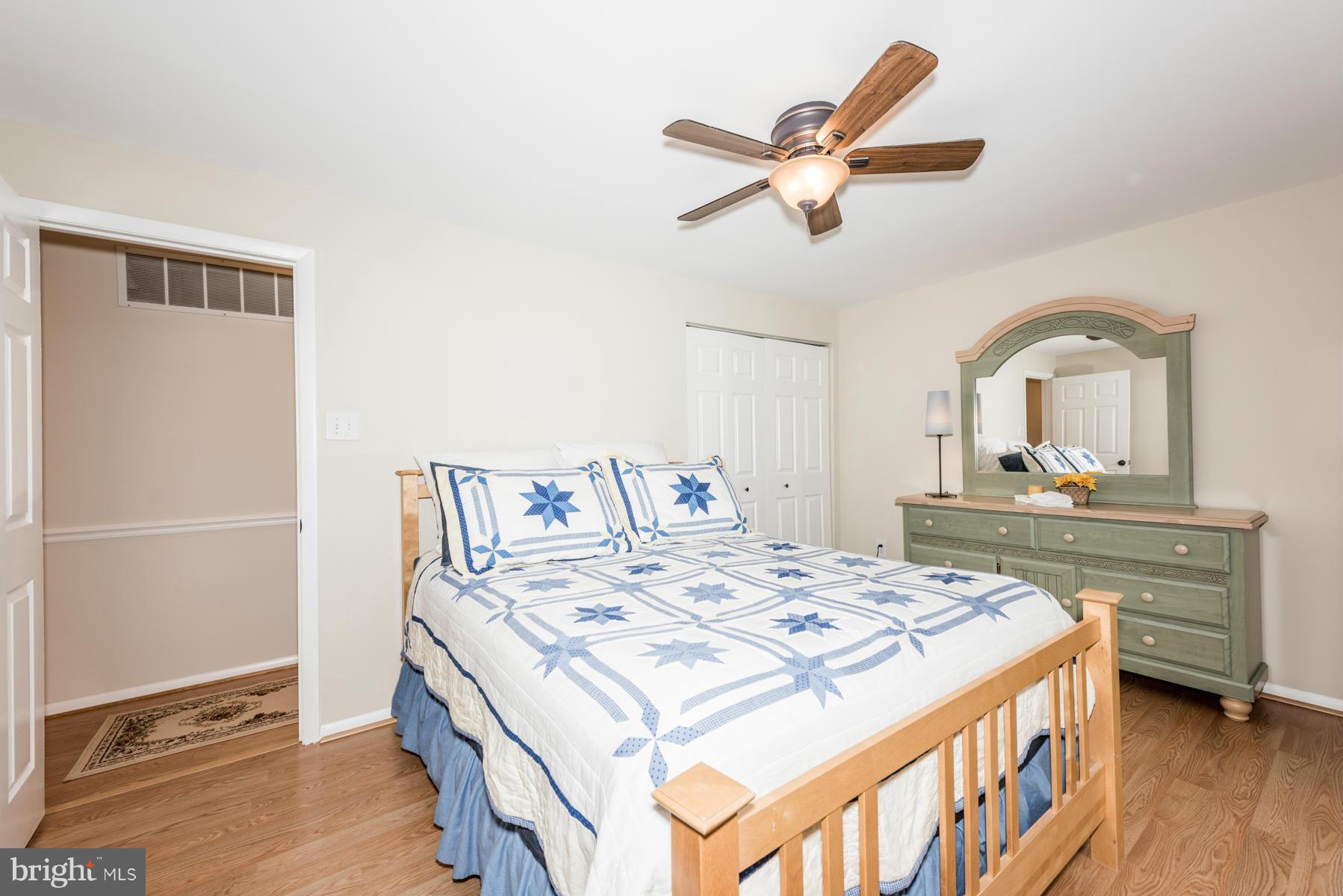 6032 Bakers Place Hanover, MD 21076 - Photo 22 of 30 a view of a bedroom with a bed and a dresser
