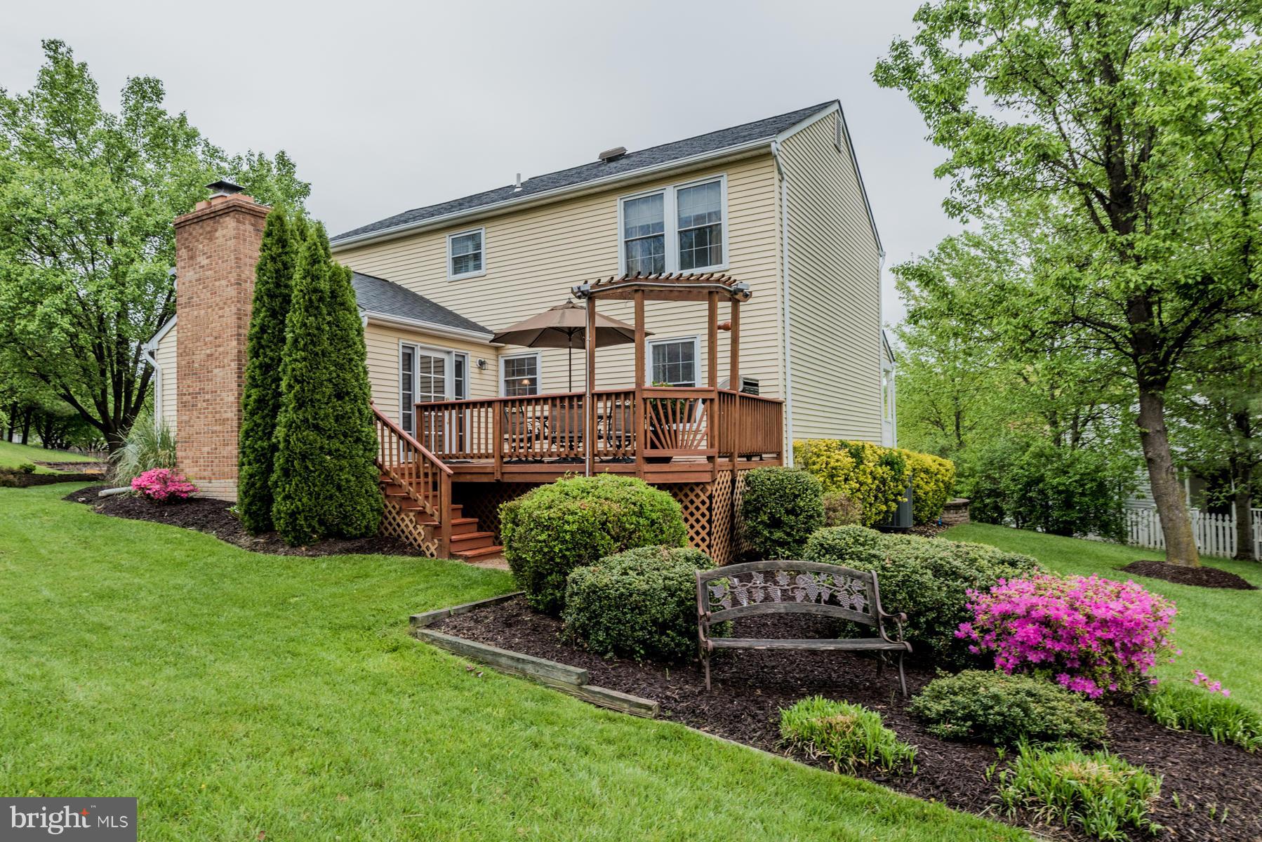 6032 Bakers Place Hanover, MD 21076 - Photo 30 of 30 a front view of a house with a yard and potted plants