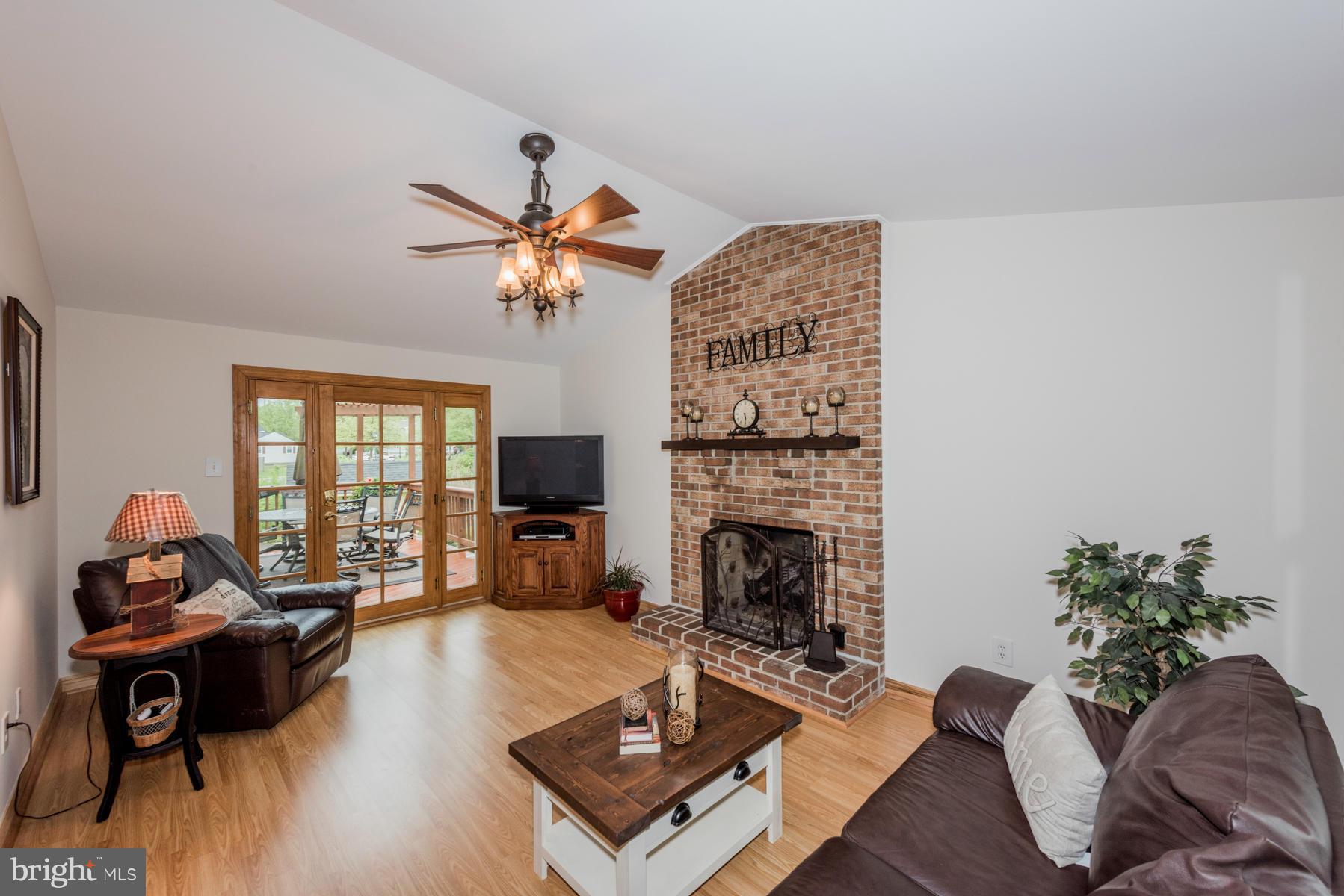 6032 Bakers Place Hanover, MD 21076 - Photo 10 of 30 a living room with furniture fireplace and a flat screen tv