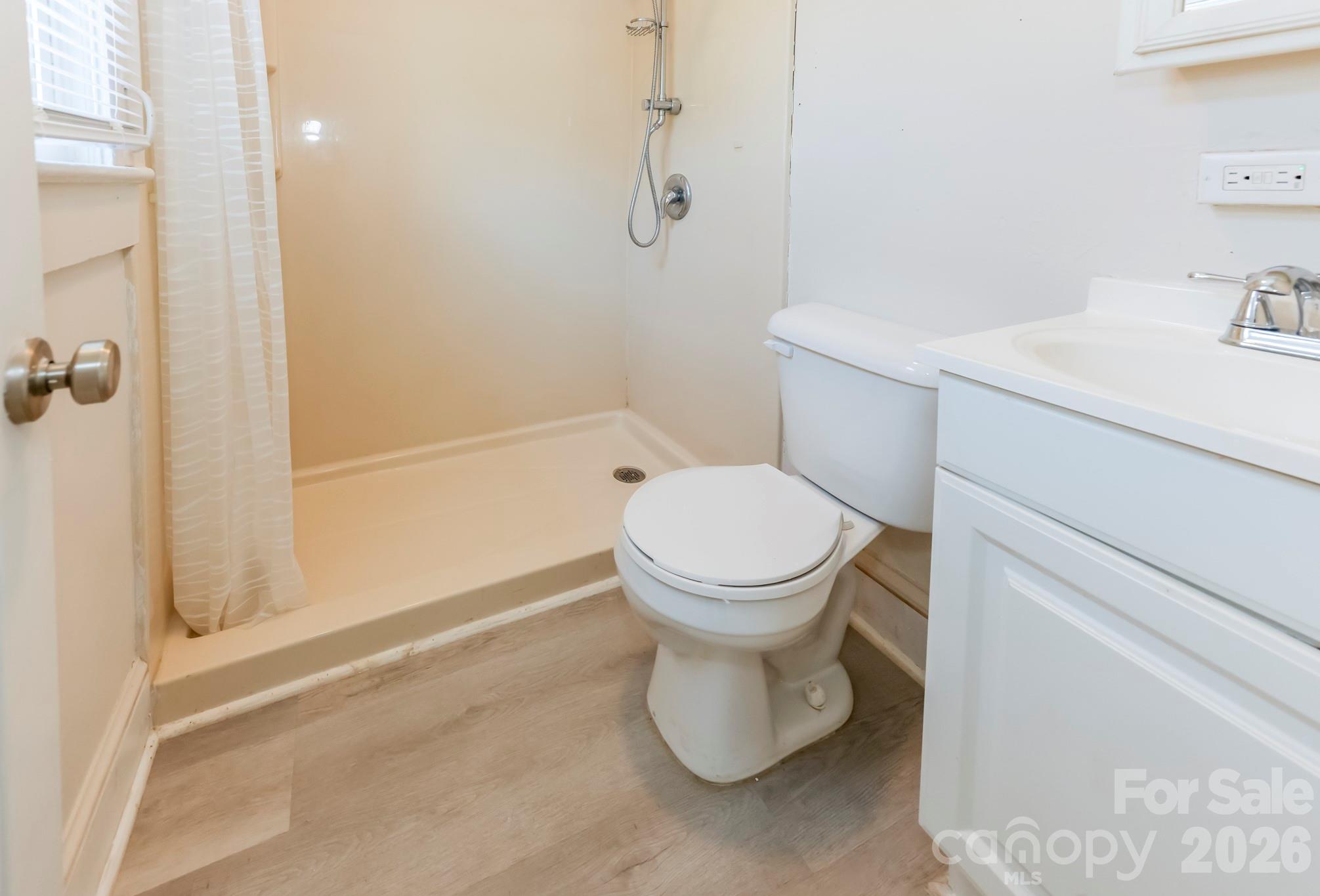 114 South Mitchell Avenue Rutherfordton, NC 28139 - Photo 21 of 29 a bathroom with a toilet sink and shower