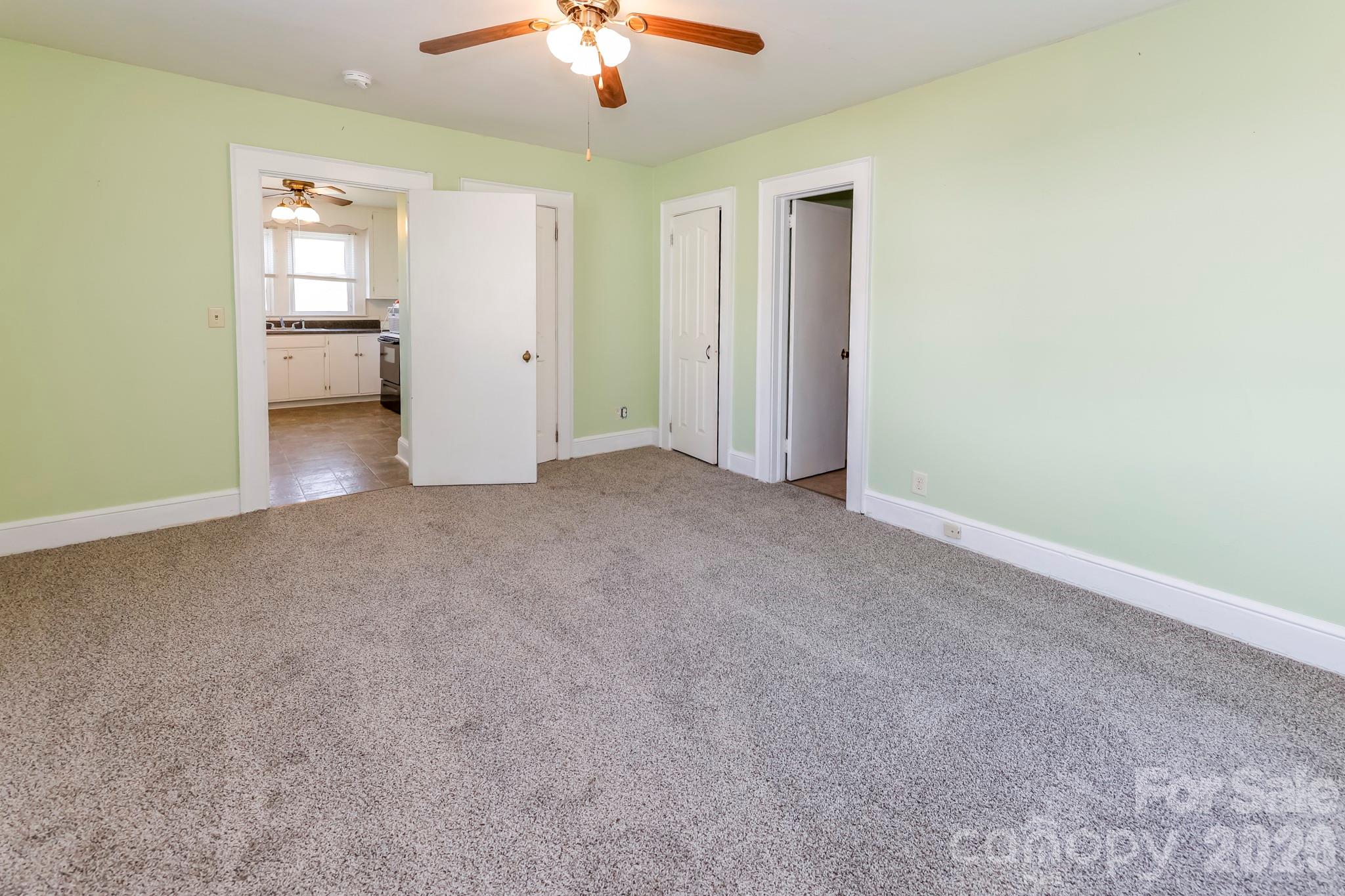 114 South Mitchell Avenue Rutherfordton, NC 28139 - Photo 26 of 29 an empty room with a bathroom and a chandelier fan