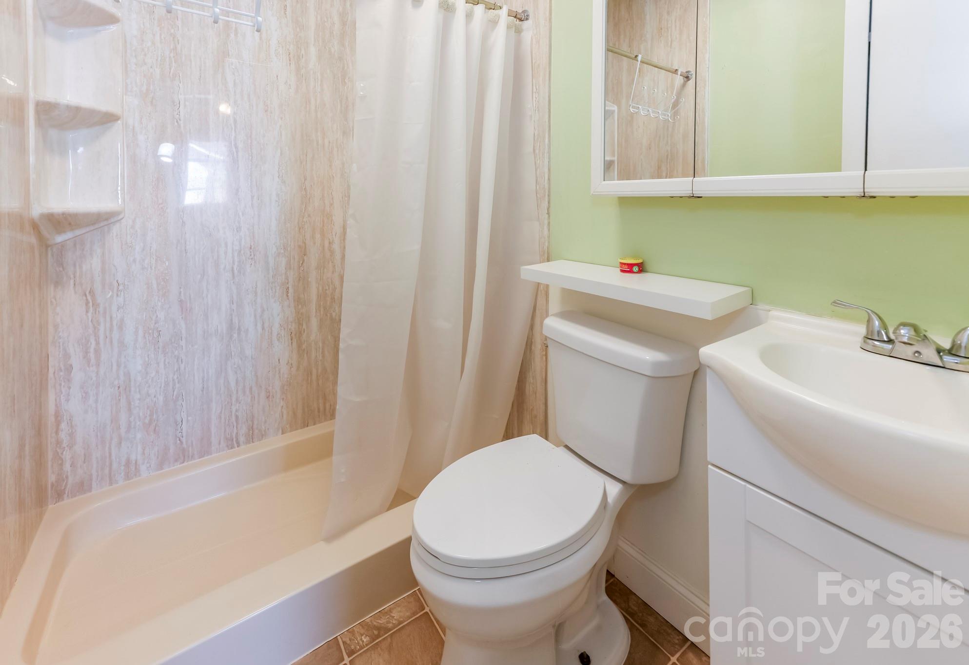 114 South Mitchell Avenue Rutherfordton, NC 28139 - Photo 28 of 29 a bathroom with a sink toilet and shower