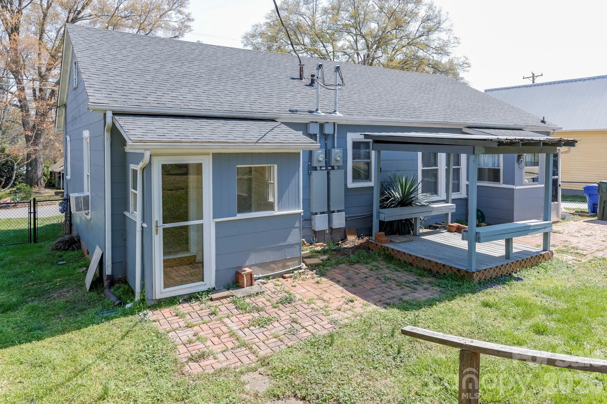 114 South Mitchell Avenue Rutherfordton, NC 28139 - Photo 7 of 29 a view of a house with backyard and porch