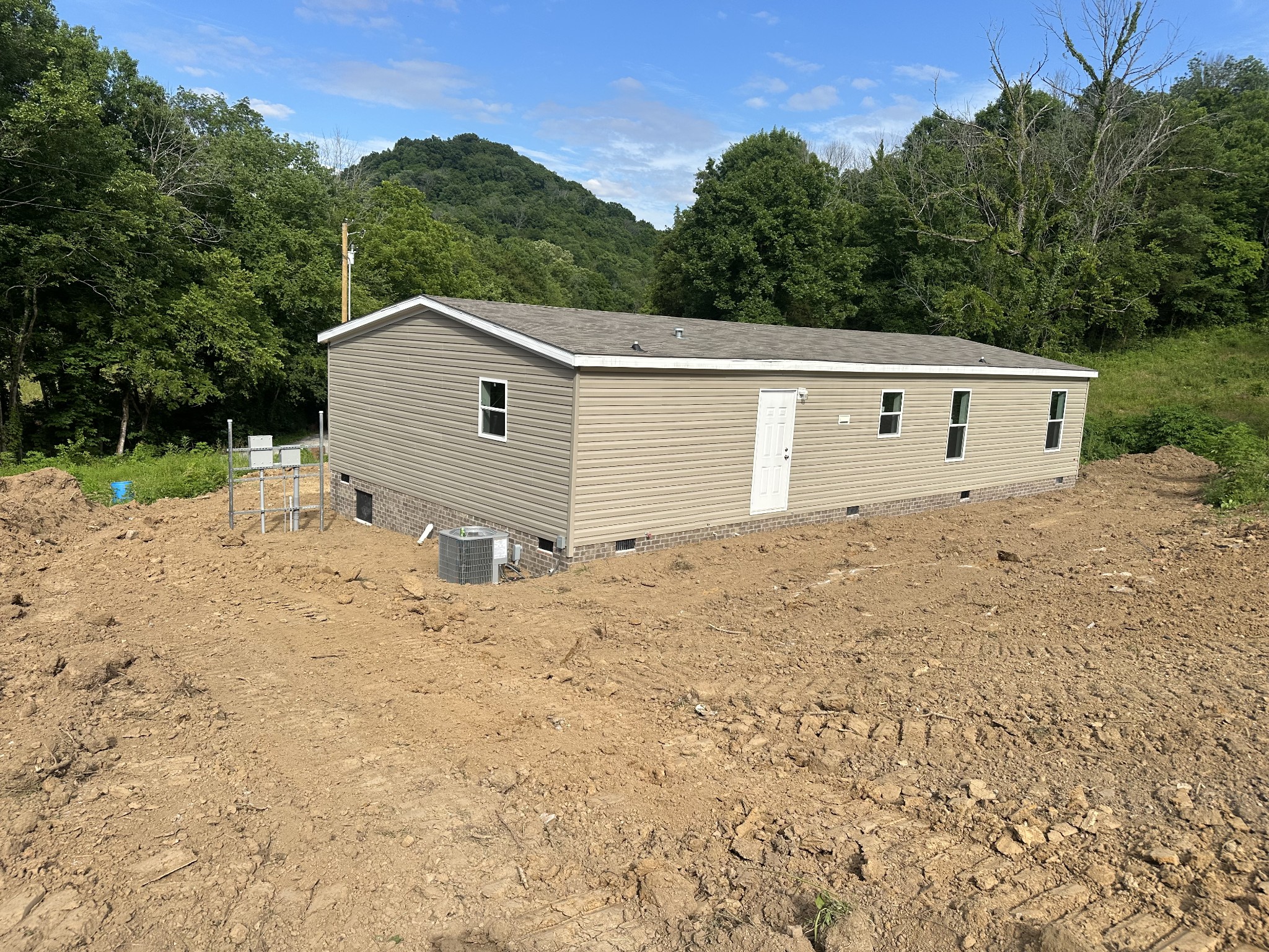 406 Shiloh Church Road Woodbury, TN 37190 - Photo 17 of 18 a view of a house with a yard