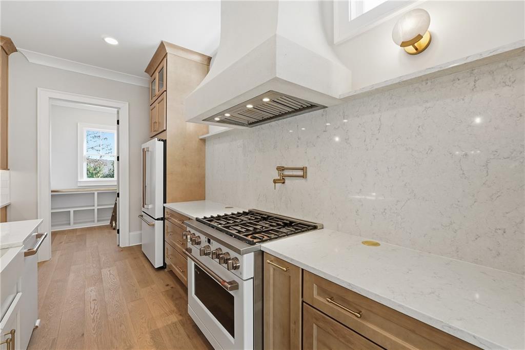 280 County Road Southwest Marietta, GA 30064 - Photo 12 of 40 a kitchen with stainless steel appliances a refrigerator and a stove
