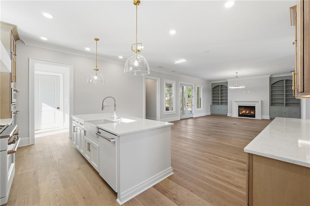 280 County Road Southwest Marietta, GA 30064 - Photo 13 of 40 a large kitchen with stainless steel appliances lots of counter space and wooden floor