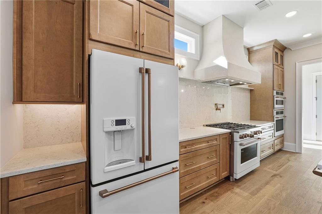 280 County Road Southwest Marietta, GA 30064 - Photo 14 of 40 a kitchen with stainless steel appliances granite countertop a stove and a refrigerator