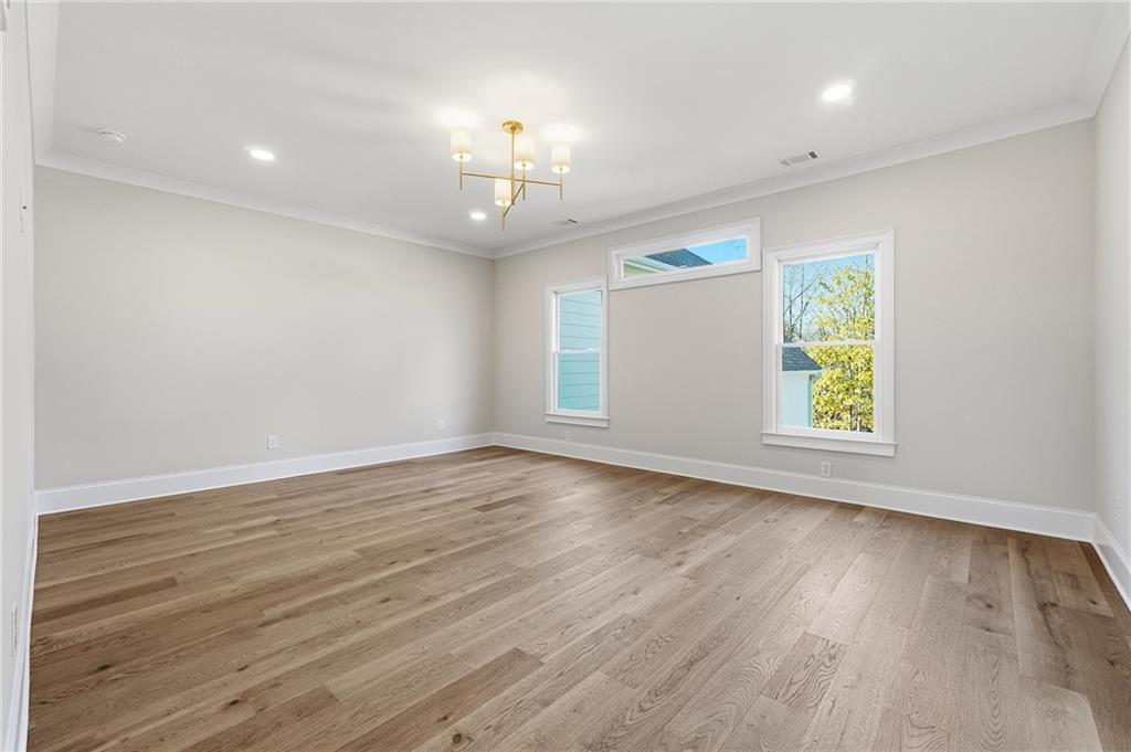 280 County Road Southwest Marietta, GA 30064 - Photo 20 of 40 an empty room with wooden floor and windows