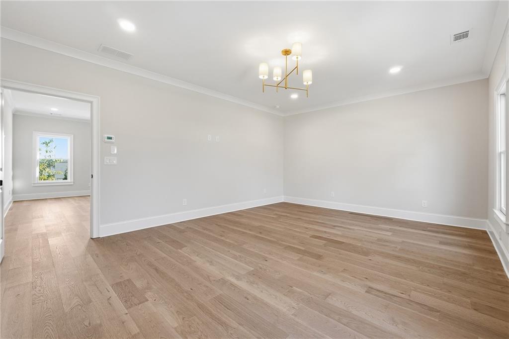 280 County Road Southwest Marietta, GA 30064 - Photo 21 of 40 wooden floor in an empty room with a window