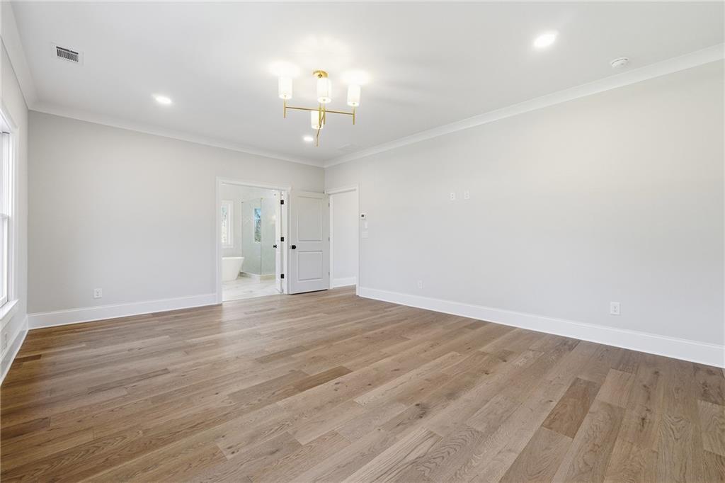 280 County Road Southwest Marietta, GA 30064 - Photo 22 of 40 an empty room with wooden floor and windows