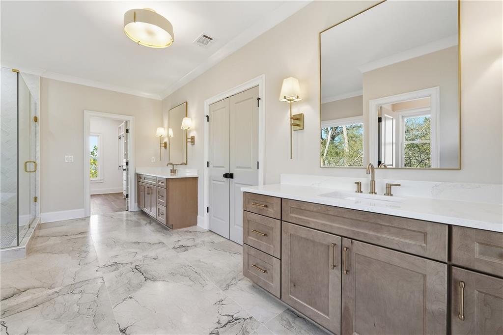 280 County Road Southwest Marietta, GA 30064 - Photo 23 of 40 a spacious bathroom with a granite countertop sink a mirror and a
