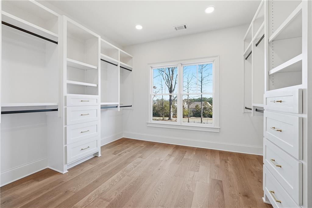 280 County Road Southwest Marietta, GA 30064 - Photo 25 of 40 a view of an empty room with wooden floor and a window
