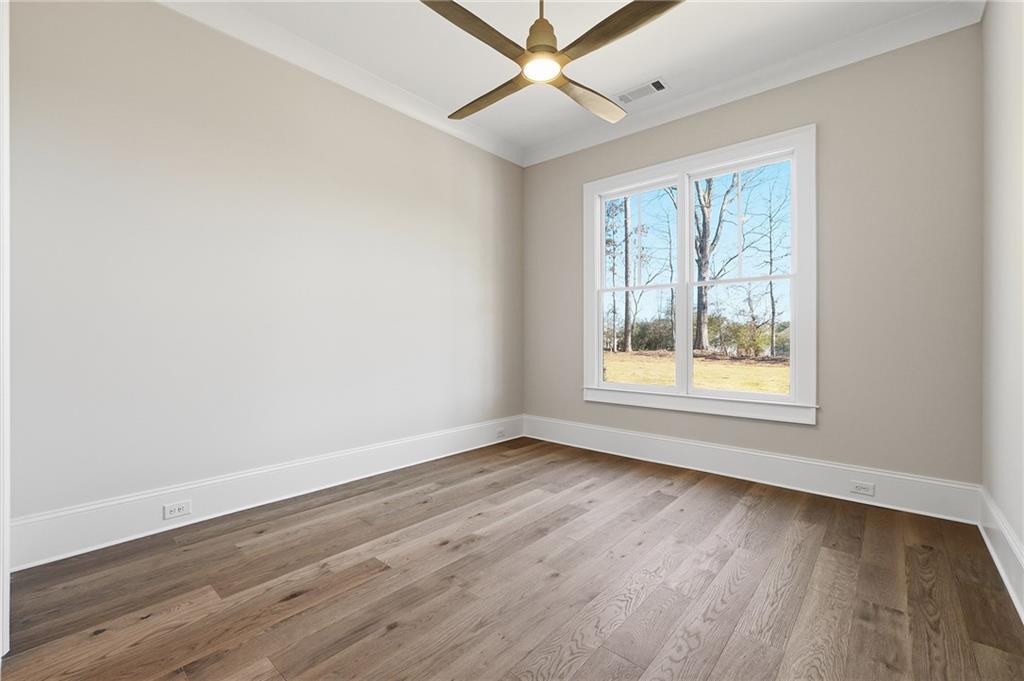 280 County Road Southwest Marietta, GA 30064 - Photo 26 of 40 a view of an empty room with wooden floor and a window