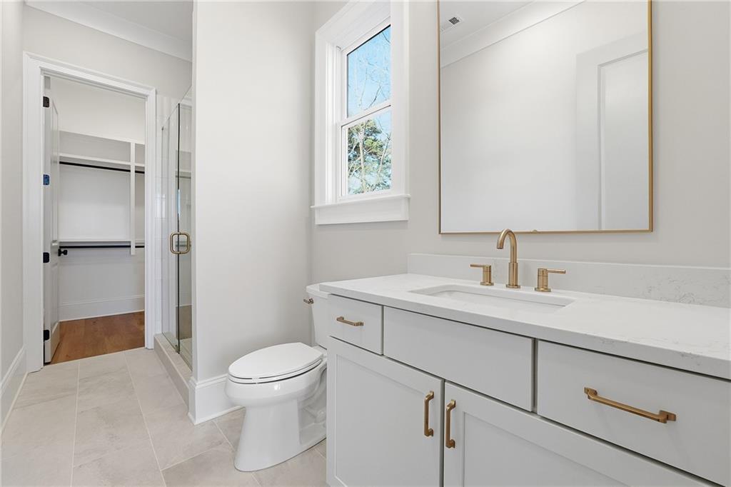 280 County Road Southwest Marietta, GA 30064 - Photo 27 of 40 a bathroom with a toilet sink and shower
