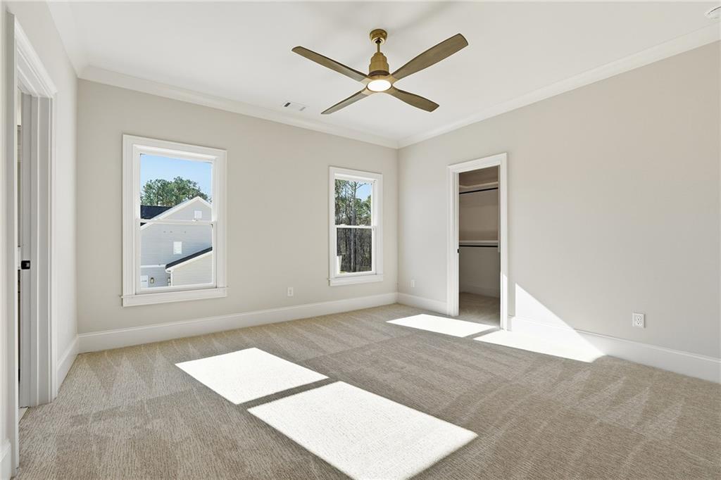 280 County Road Southwest Marietta, GA 30064 - Photo 30 of 40 an empty room with windows and ceiling fan