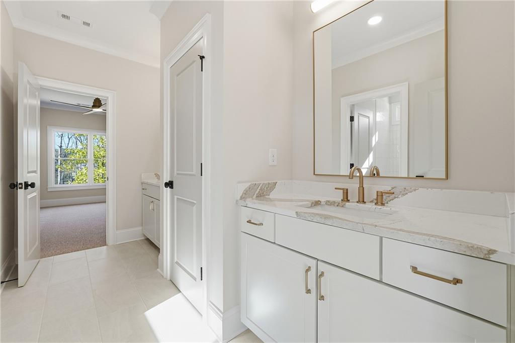 280 County Road Southwest Marietta, GA 30064 - Photo 31 of 40 a en suite bathroom with a sink and a mirror