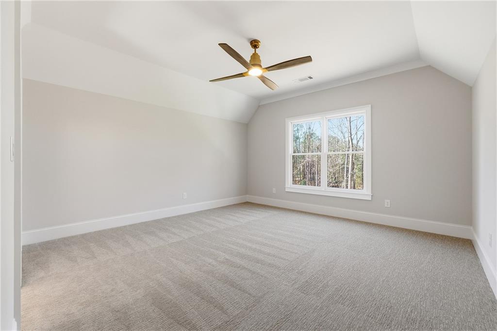 280 County Road Southwest Marietta, GA 30064 - Photo 34 of 40 an empty room with a ceiling fan and window