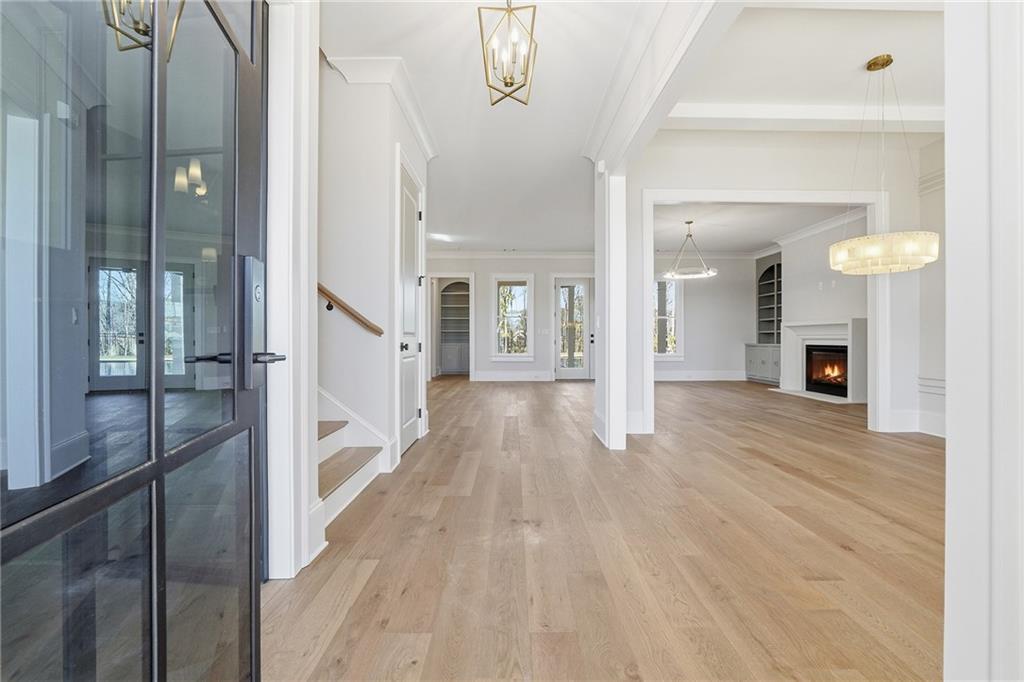 280 County Road Southwest Marietta, GA 30064 - Photo 4 of 40 a view of a hallway with wooden floor and a fireplace