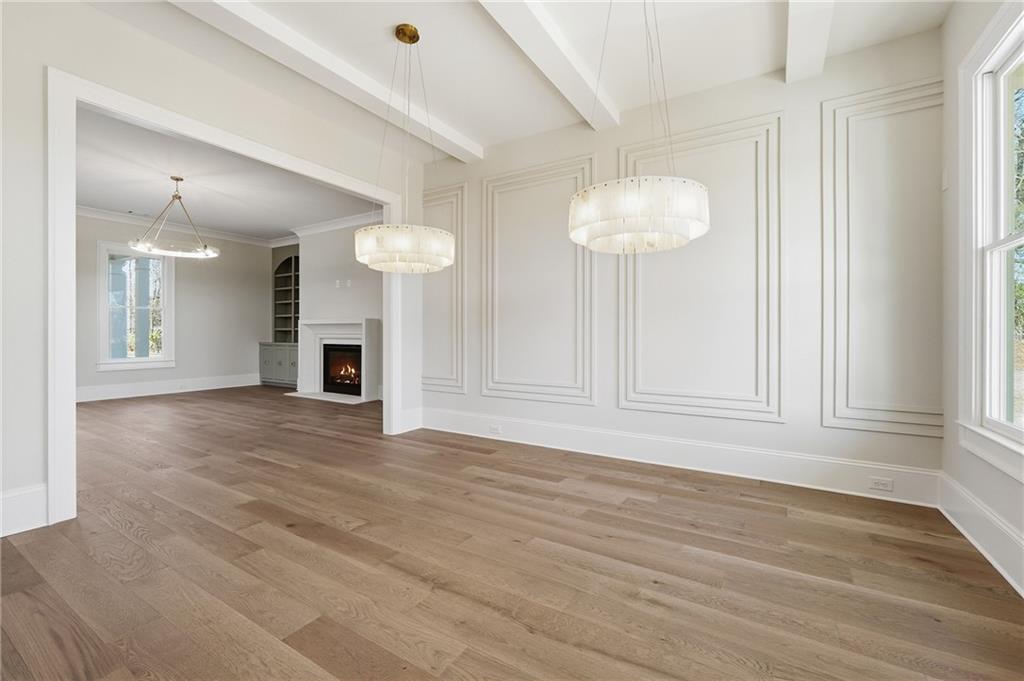 280 County Road Southwest Marietta, GA 30064 - Photo 6 of 40 an empty room with wooden floor and windows