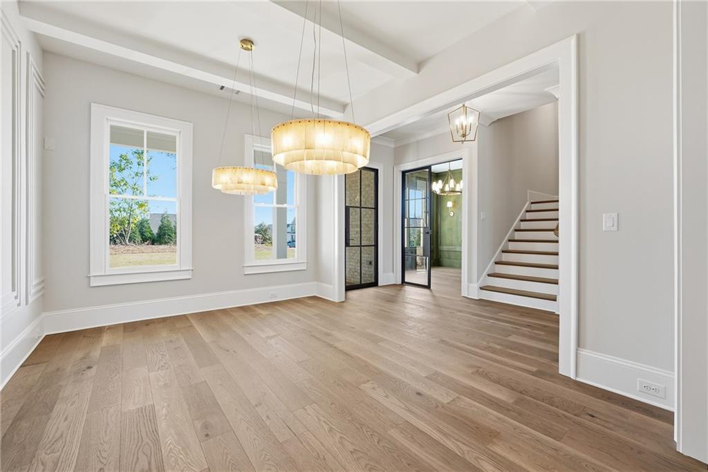 280 County Road Southwest Marietta, GA 30064 - Photo 7 of 40 an empty room with wooden floor and windows