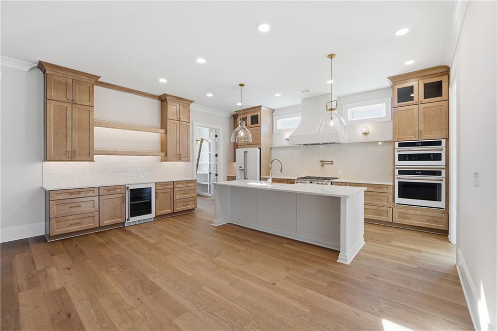 280 County Road Southwest Marietta, GA 30064 - Photo 10 of 40 a large kitchen with stainless steel appliances wooden floor and a large window