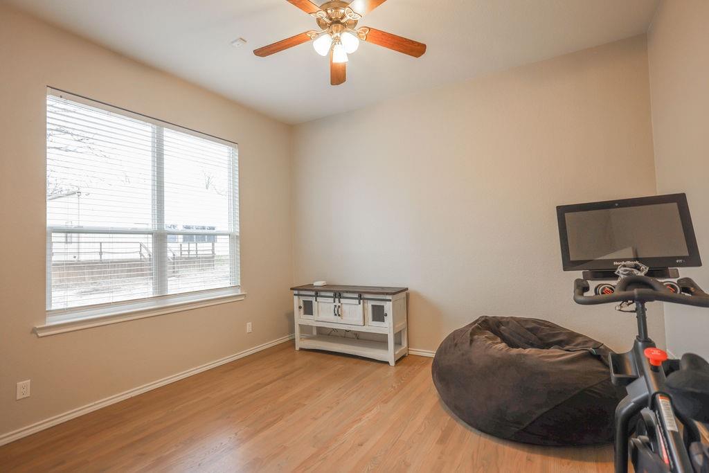9501 Oakwood Road Quinlan, TX 75474 - Photo 17 of 34 a view of a workspace with furniture and a window