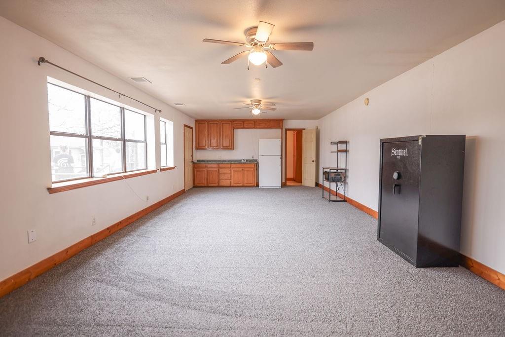 9501 Oakwood Road Quinlan, TX 75474 - Photo 21 of 34 a view of livingroom with a ceiling fan and window