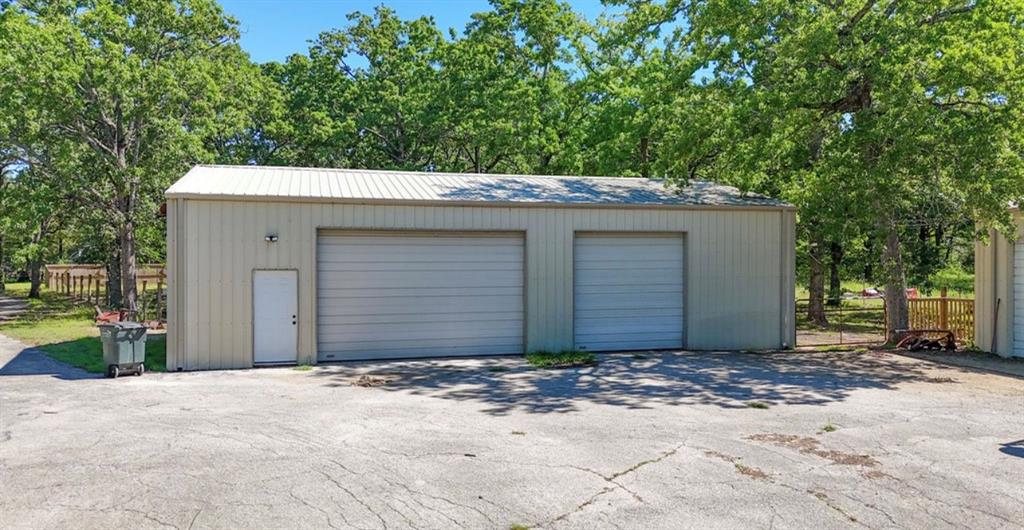 9501 Oakwood Road Quinlan, TX 75474 - Photo 25 of 34 a front view of a house