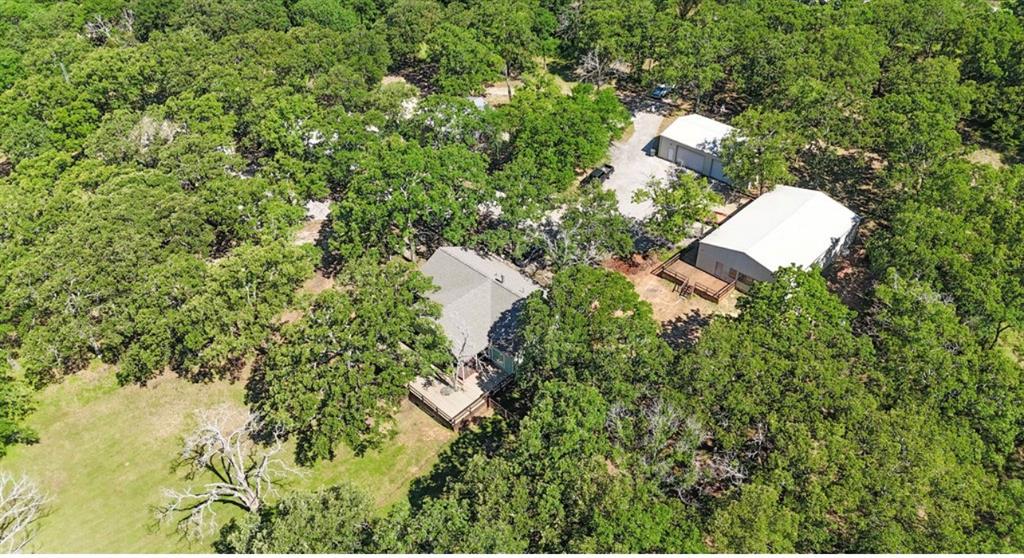 9501 Oakwood Road Quinlan, TX 75474 - Photo 27 of 34 an aerial view of a house with a yard and outdoor seating