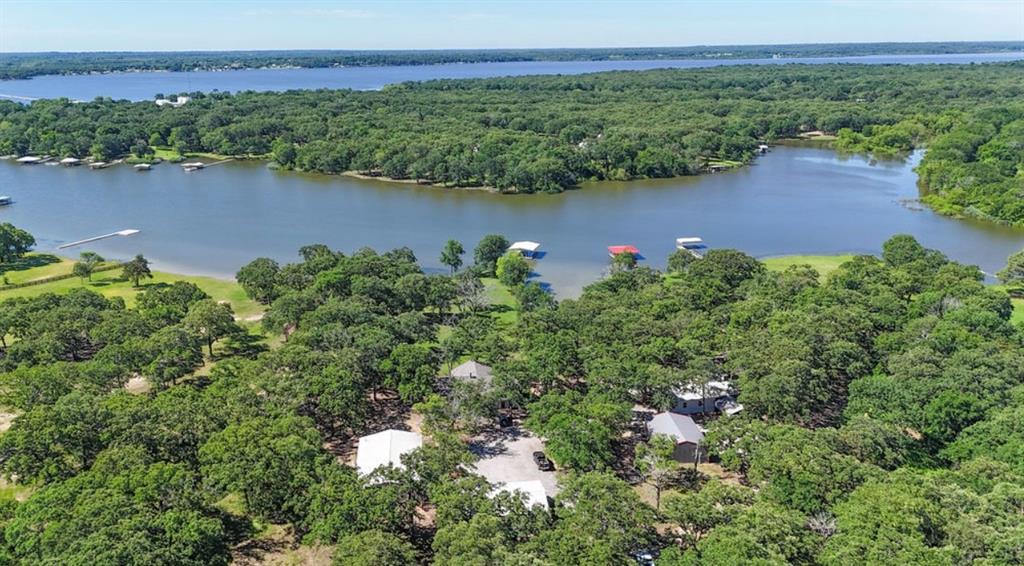 9501 Oakwood Road Quinlan, TX 75474 - Photo 33 of 34 an aerial view of residential houses with outdoor space and trees