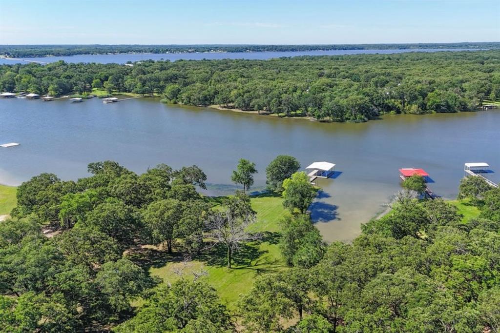 9501 Oakwood Road Quinlan, TX 75474 - Photo 34 of 34 an aerial view of a houses with a lake view