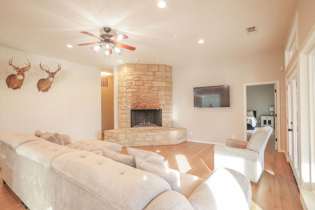 9501 Oakwood Road Quinlan, TX 75474 - Photo 9 of 34 a bedroom with a large bed and a flat screen tv