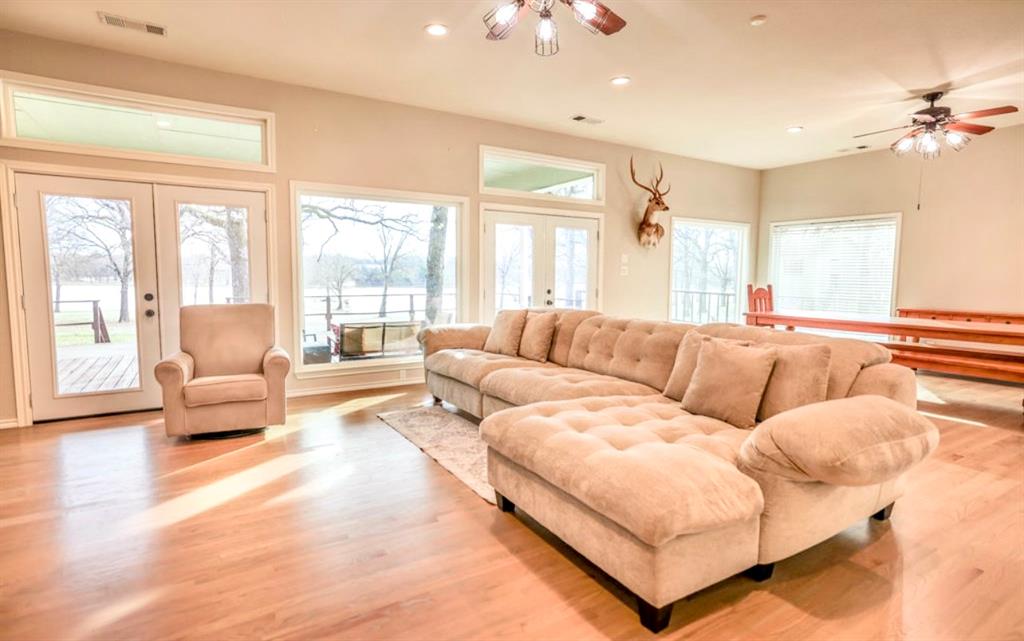 9501 Oakwood Road Quinlan, TX 75474 - Photo 10 of 34 a living room with furniture and a large window