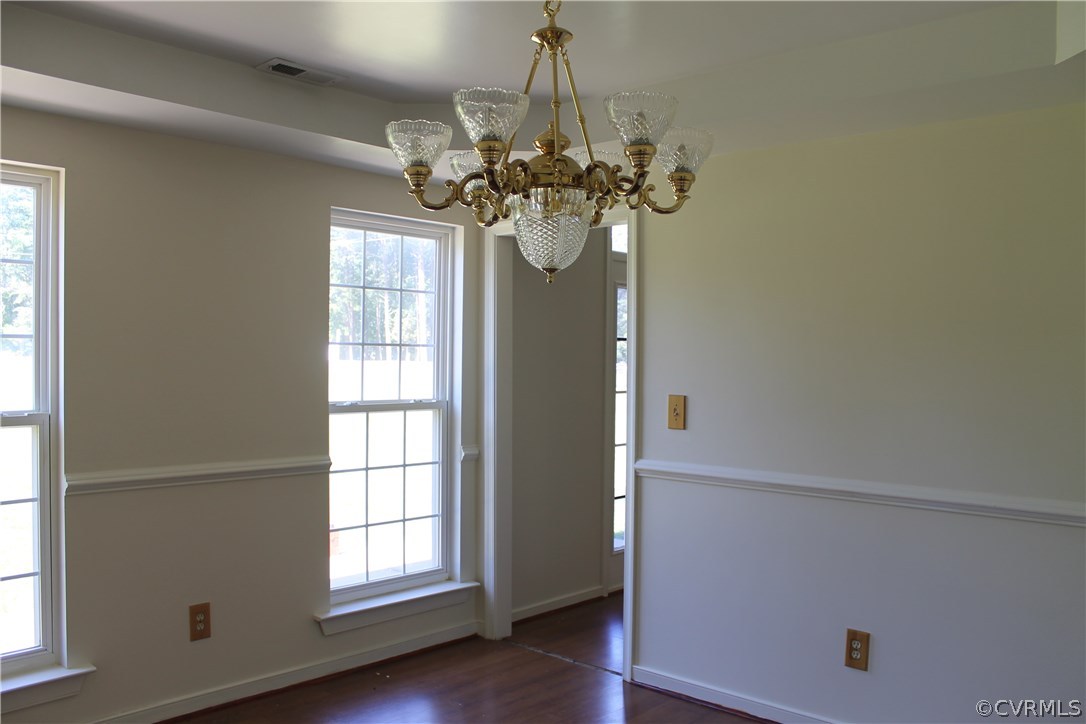 329 Mallory Road Louisa, VA 23093 - Photo 5 of 12 a view of a room with wooden floor chandelier and windows