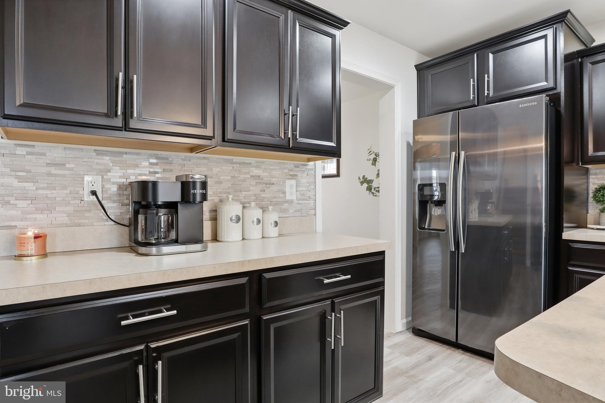 99 McIntosh Lane Aspers, PA 17304 - Photo 15 of 63 a kitchen with stainless steel appliances granite countertop a refrigerator and a sink