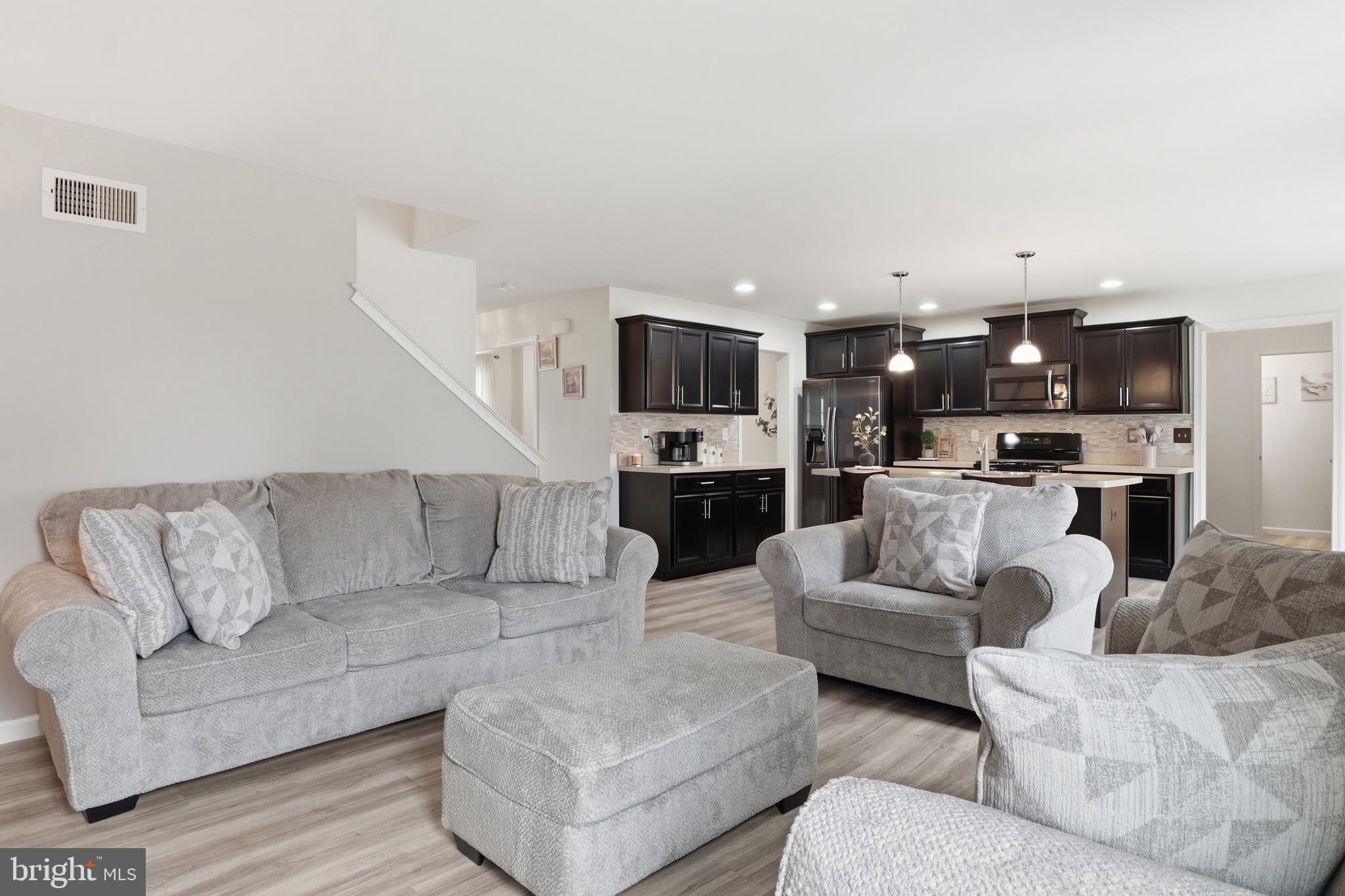 99 McIntosh Lane Aspers, PA 17304 - Photo 19 of 63 a living room with furniture and kitchen view