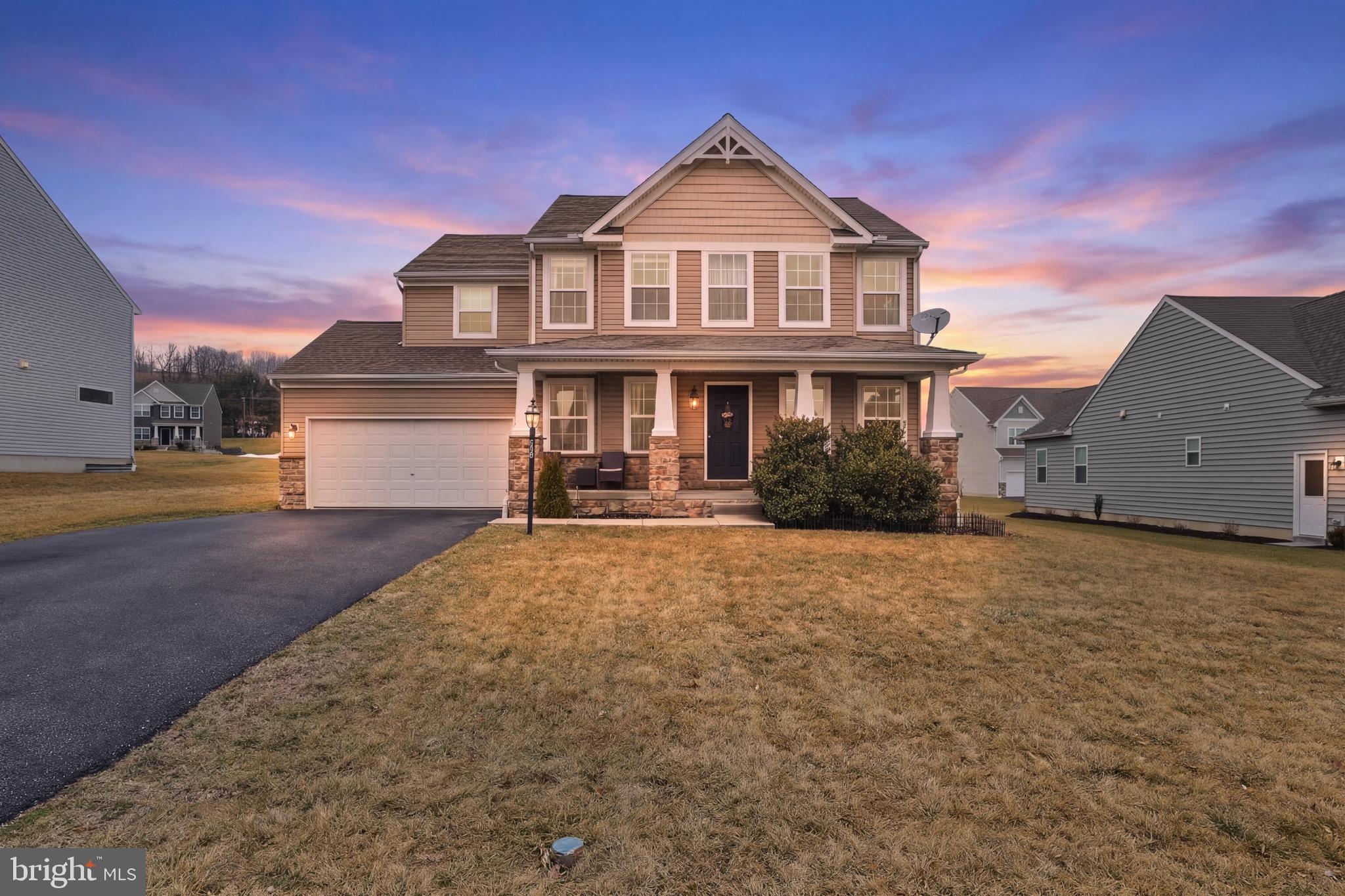 99 McIntosh Lane Aspers, PA 17304 - Photo 2 of 63 a front view of a house with a garden and yard