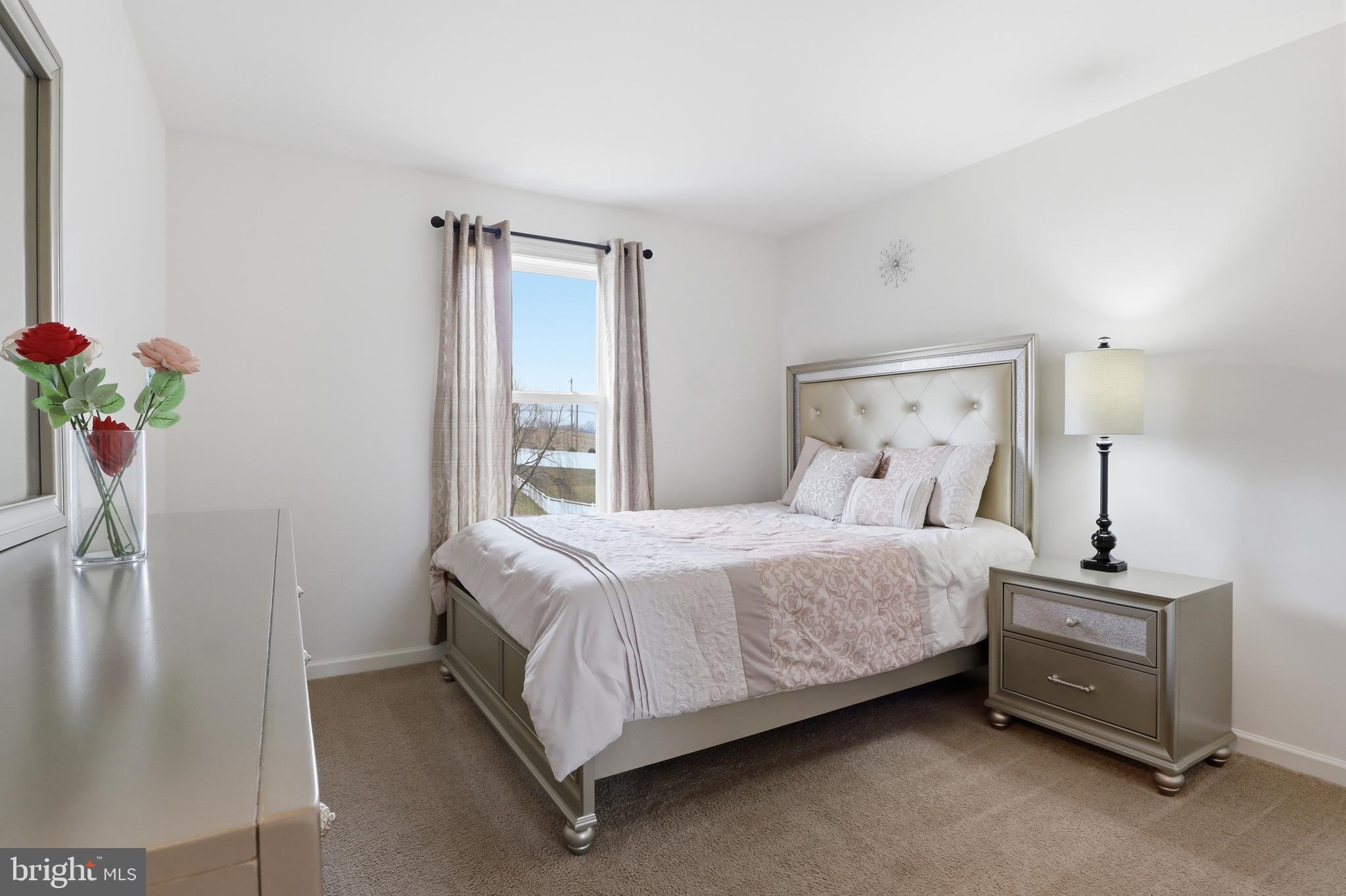 99 McIntosh Lane Aspers, PA 17304 - Photo 27 of 63 a bedroom with a bed and a potted plant