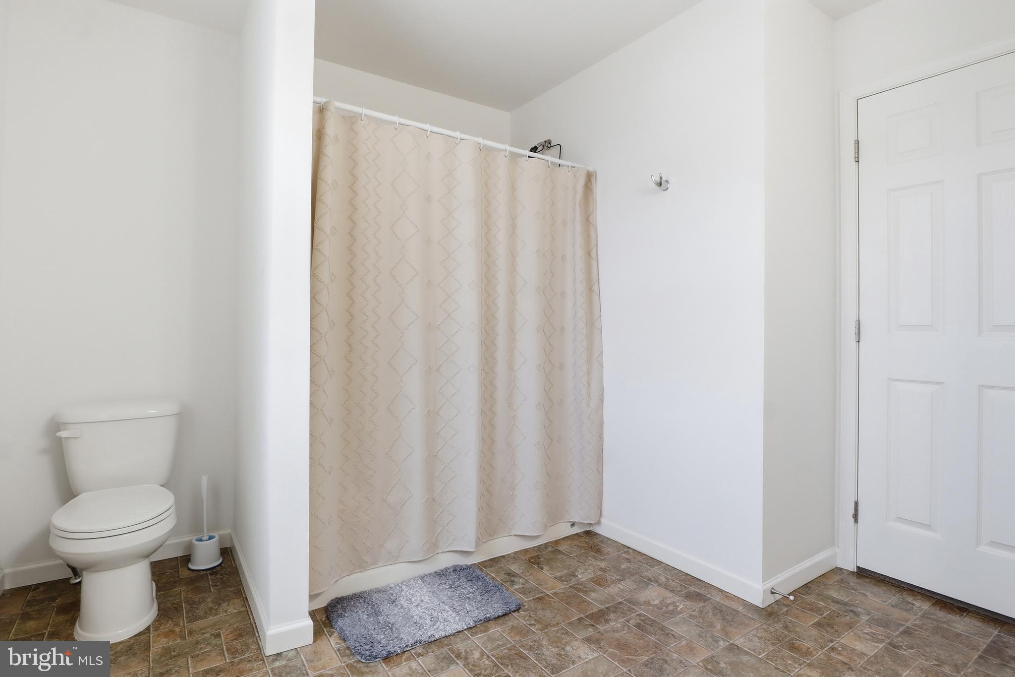 99 McIntosh Lane Aspers, PA 17304 - Photo 35 of 63 a bathroom with a toilet and a shower