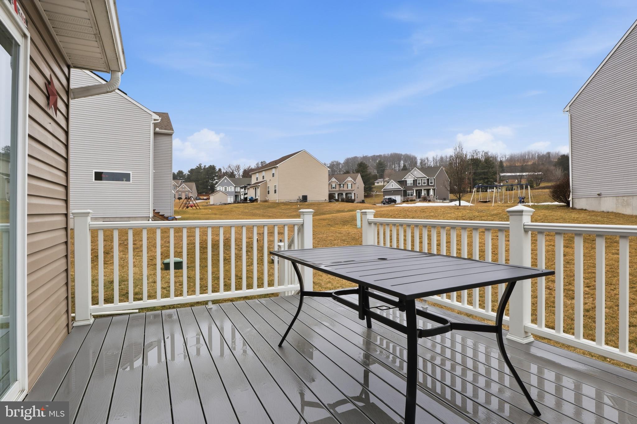 99 McIntosh Lane Aspers, PA 17304 - Photo 43 of 63 a view of a balcony with wooden floor and outdoor seating