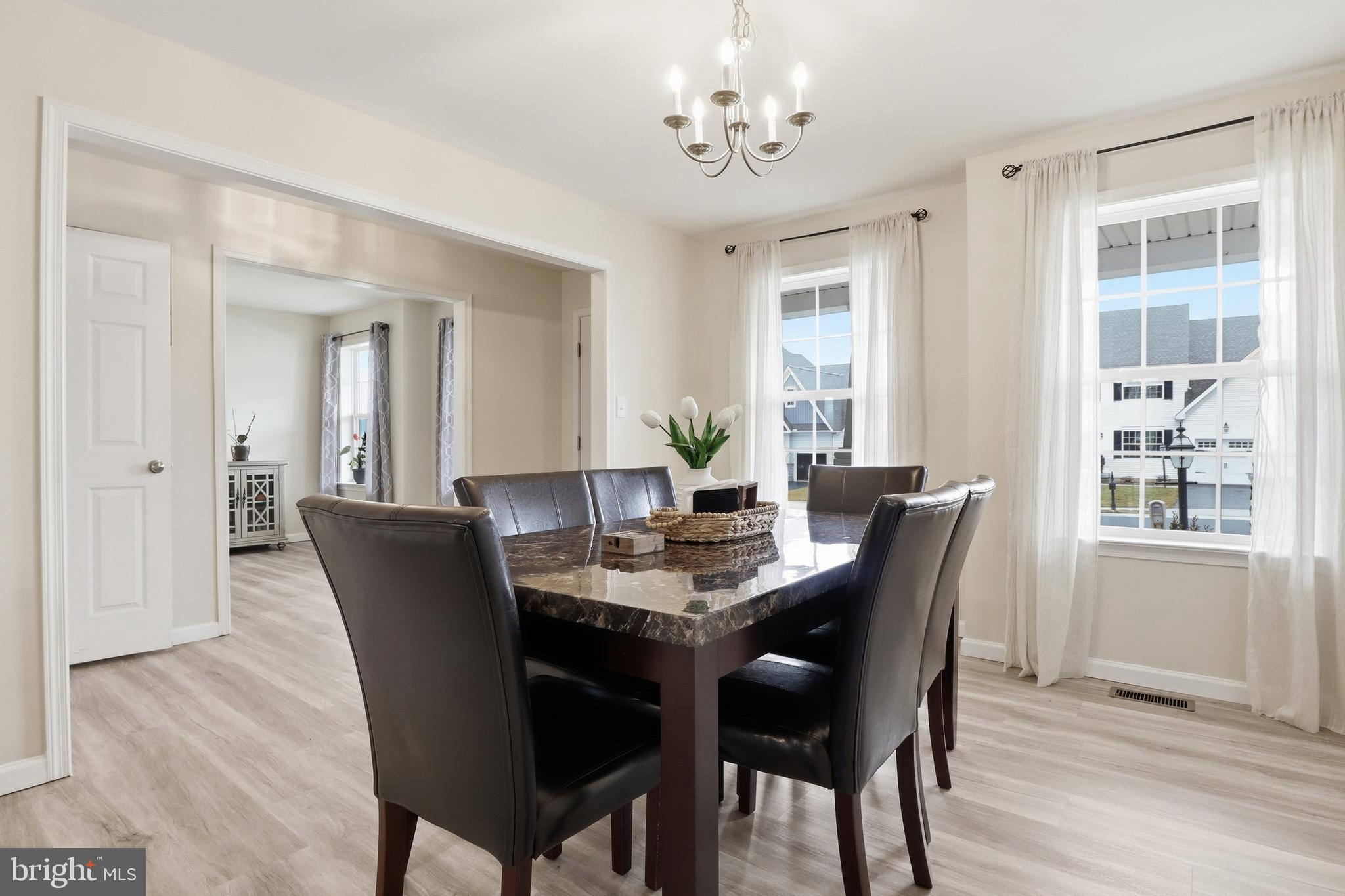 99 McIntosh Lane Aspers, PA 17304 - Photo 9 of 63 a view of a dining room with furniture window and wooden floor