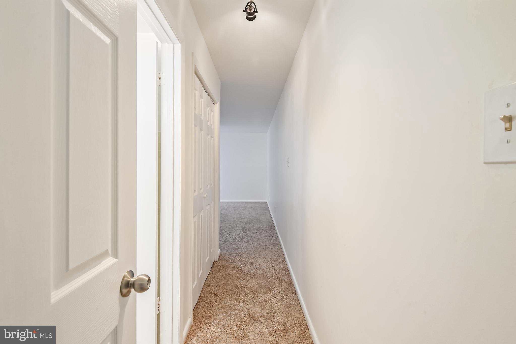 8300 Tobin Road, Unit 13 Annandale, VA 22003 - Photo 29 of 36 Hallway master bedroom with bathroom on left side