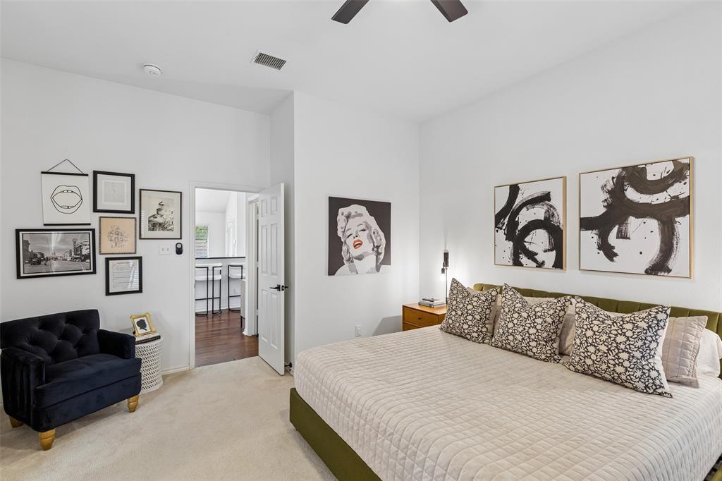7703 Worthing Street Dallas, TX 75252 - Photo 11 of 21 a bedroom with a bed and couch