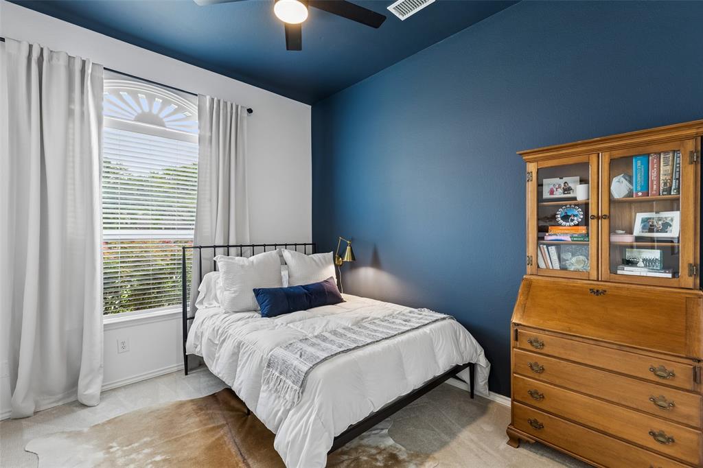 7703 Worthing Street Dallas, TX 75252 - Photo 16 of 21 a bedroom with a bed and a window