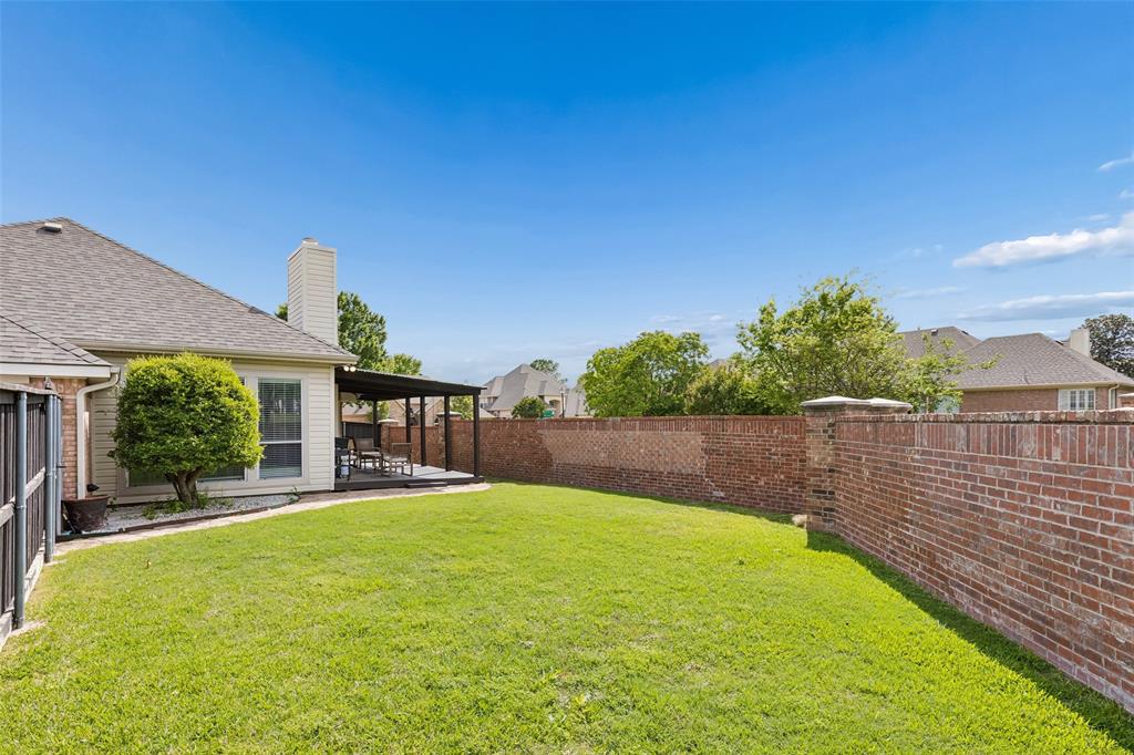 7703 Worthing Street Dallas, TX 75252 - Photo 17 of 21 a swimming pool with outdoor seating and yard