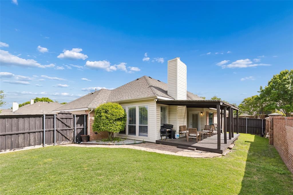 7703 Worthing Street Dallas, TX 75252 - Photo 18 of 21 a view of a house with backyard porch and sitting area