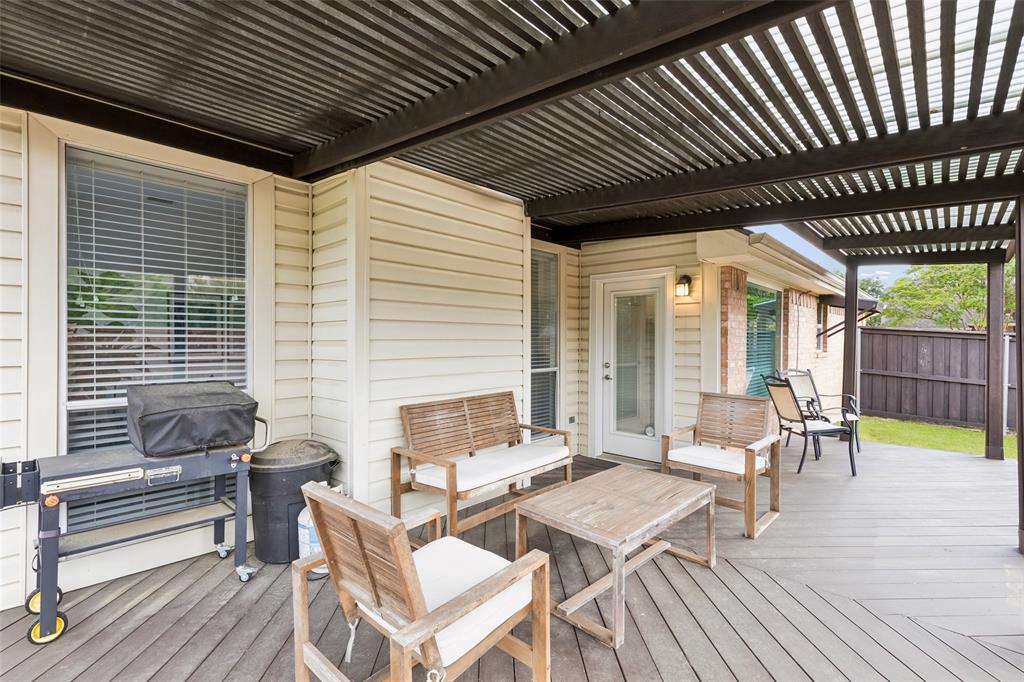 7703 Worthing Street Dallas, TX 75252 - Photo 19 of 21 a balcony with furniture and wooden floor