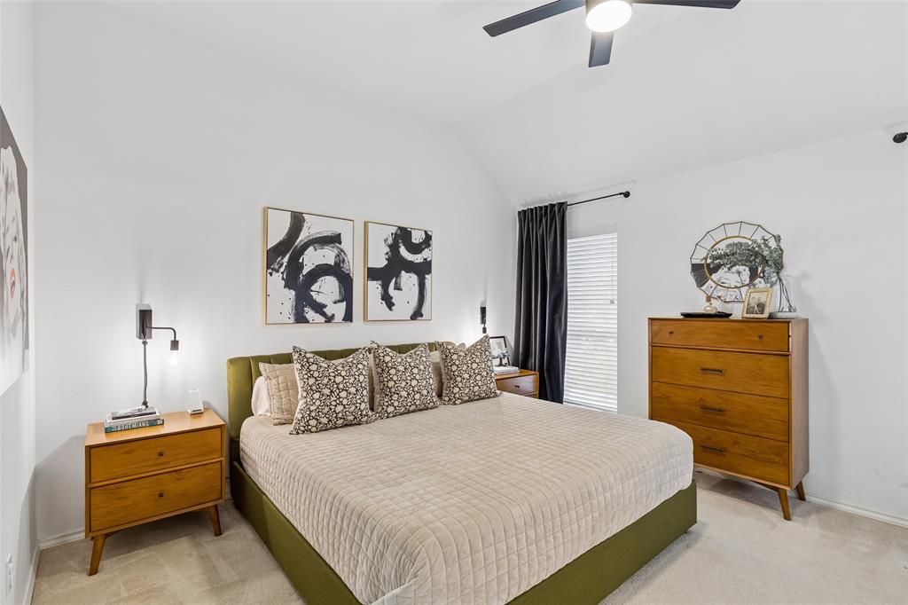 7703 Worthing Street Dallas, TX 75252 - Photo 10 of 21 a bedroom with a bed and a dresser