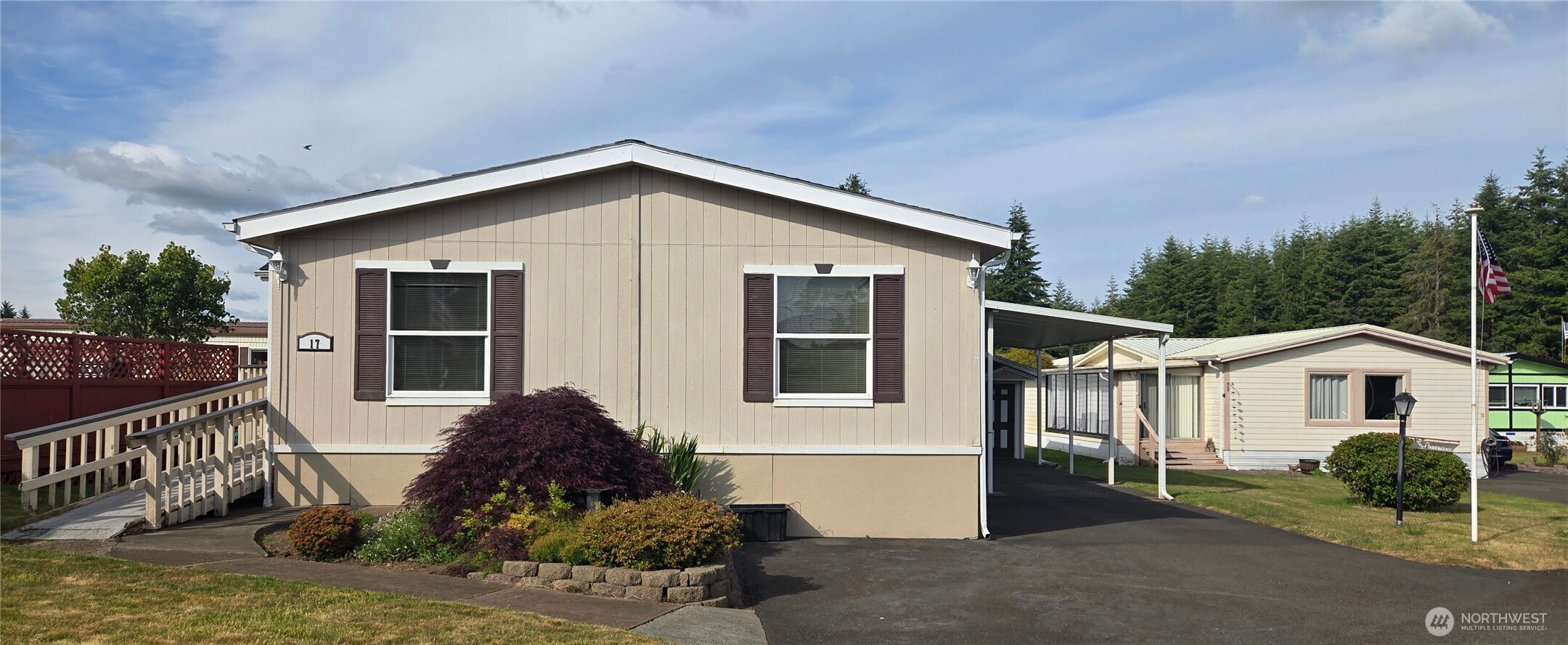 57 Clemons Road, Unit 17 Montesano, WA 98563 - Photo 1 of 26 a front view of a house with garden